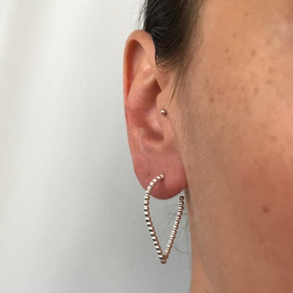 dotty teardrop hoops worn