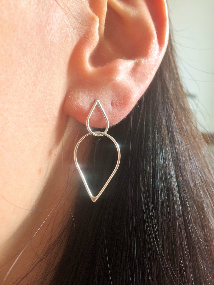 double teardrop studs worn