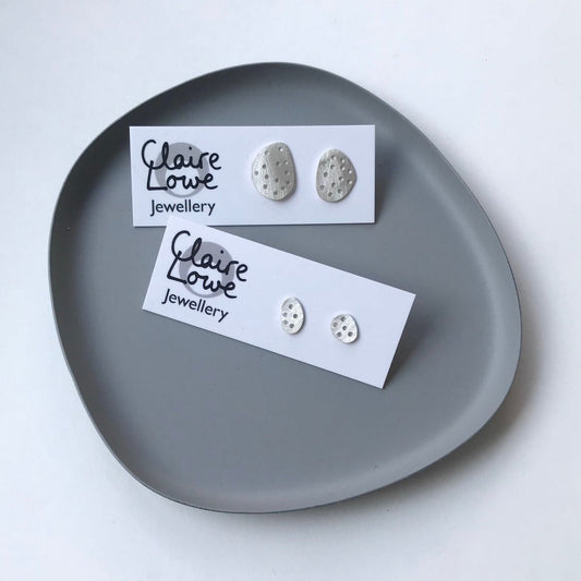 Drilled pebble studs