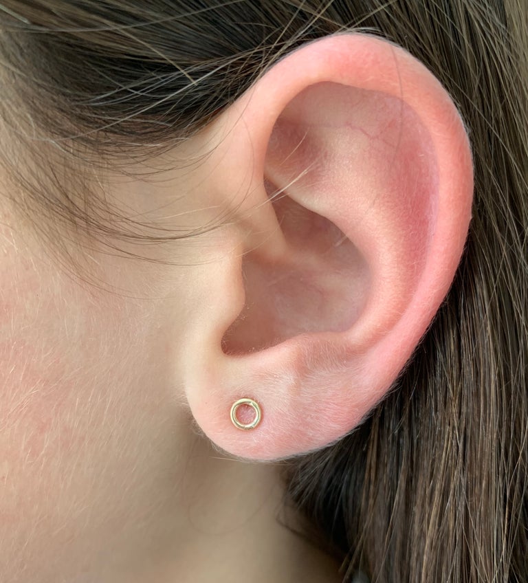 gold circle stud worn