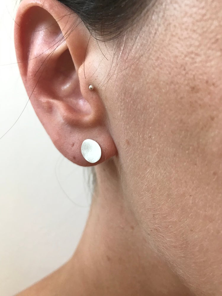 pebble studs worn
