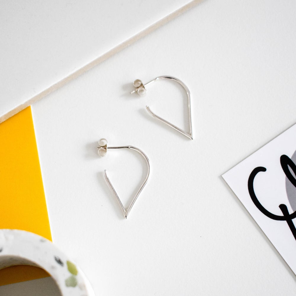 Silver teardrop hoop earrings