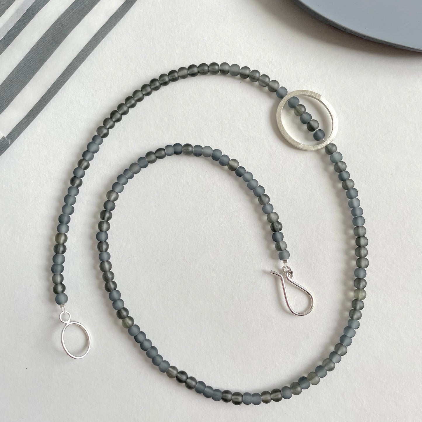 Grey Glass Bead Necklace with a Silver Pebble