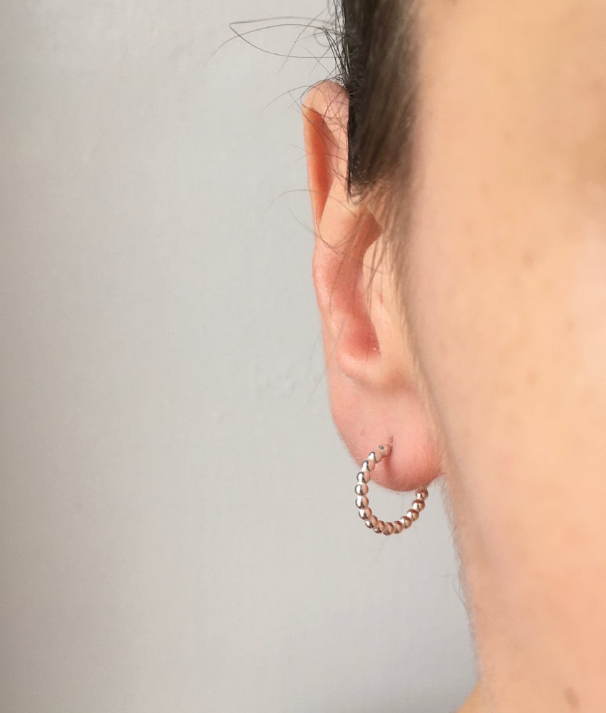 small dotty hoops worn