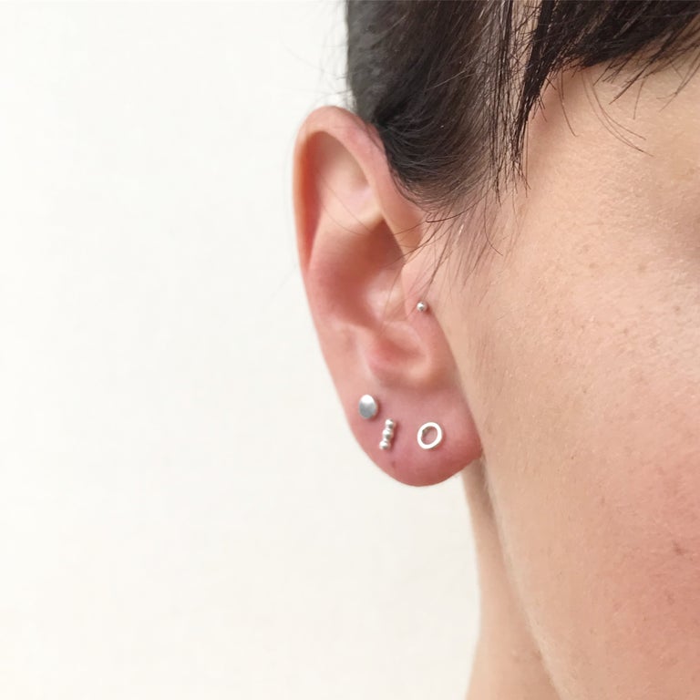 trio stud earring set worn